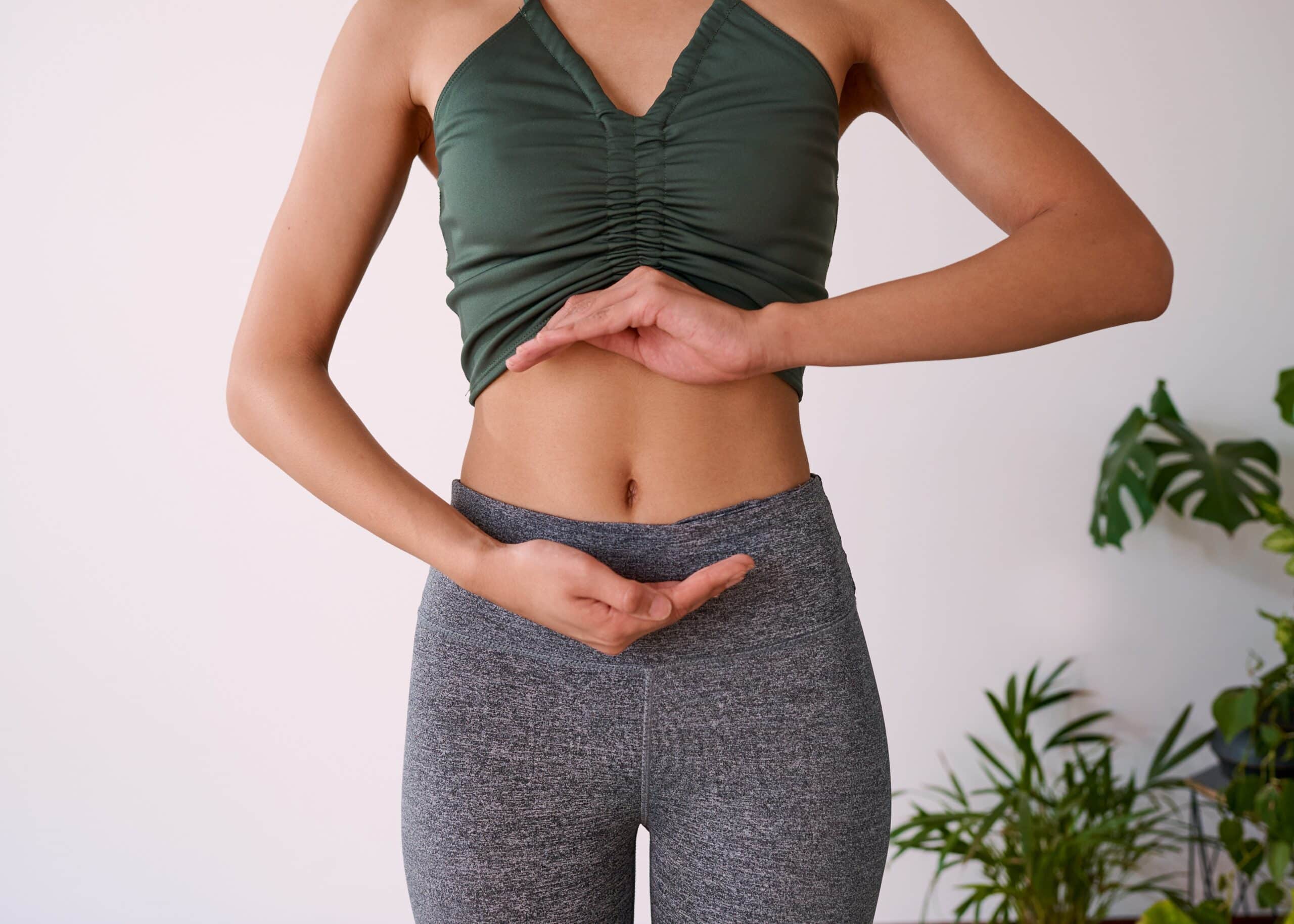 A woman touching her stomach