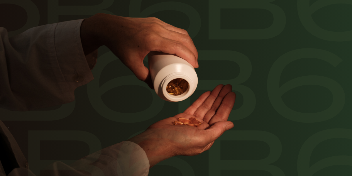 Woman tilting a bottle of vitamin b6 into hand to get out a tablet